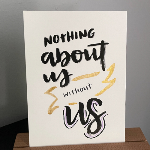 Watercolor lettering of nothing about us without us